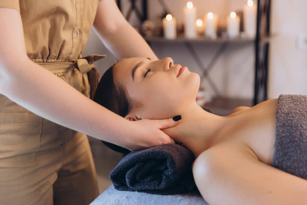 Massage therapist in Grand Rapids providing a relaxing wellness massage to support year-round self-care.