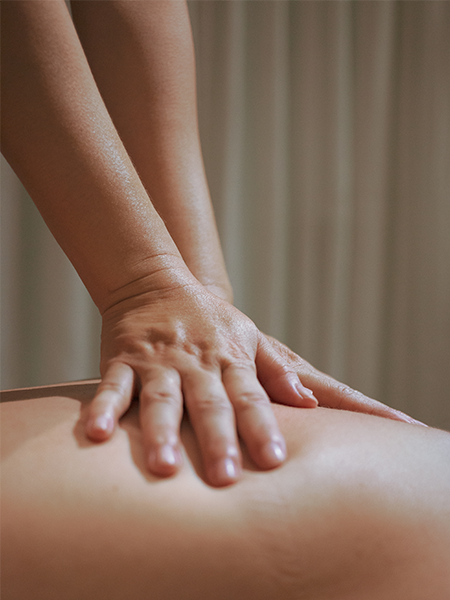 Lymphatic Drainage Massage on the back of woman in spa.