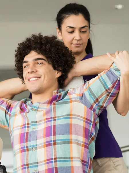 A relaxed woman with hot stones on her back