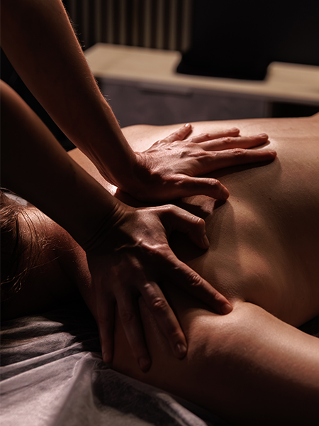 Relaxing back massage in spa salon. Professional therapist performing luxury wellness treatment for stress relief and relaxation.